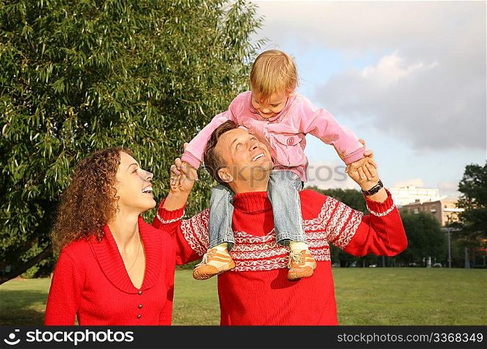 family with the daughter, who sits on the shoulders of the father