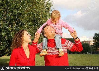 family with the daughter, who sits on the shoulders of the father
