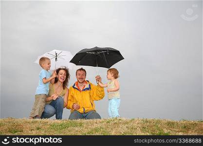 family with the umbrellas