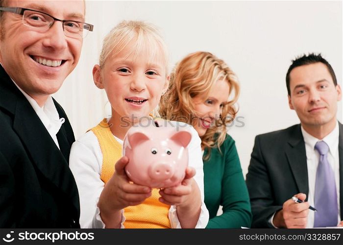 Family with their consultant (assets, money or similar) doing some financial planning - symbolized by a piggy bank the daughter is holding in her hand