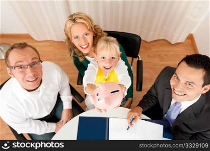 Family with their consultant (assets, money or similar) doing some financial planning - symbolized by a piggy bank they are holding in their hand