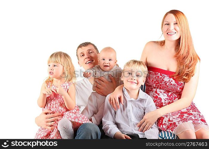 family with three children is sitting on a striped chair. man and woman is smiling. isolated.