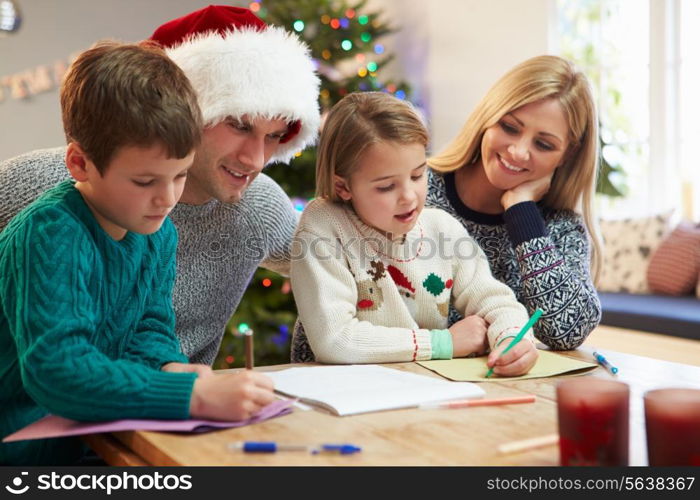 Family Writing Christmas Cards Together