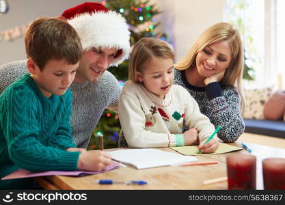 Family Writing Christmas Cards Together