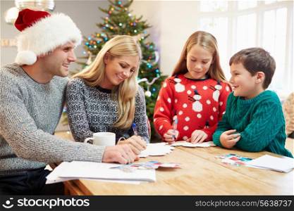 Family Writing Christmas Cards Together