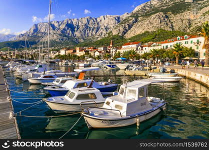 Famous Adriatic coast - Makarska riviera in Dalmatia. Town Makarska, promenade and marine. 17.09.2019. Splendid town and tourist resort Makarska, Croatia