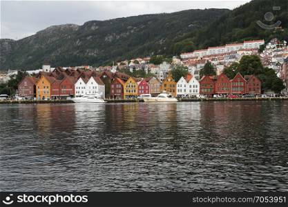 Famous Bryggen street with wooden colored houses in Bergen