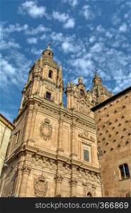 Famous Casa de las Conchas with La Clerecia Church in Salamanca, Castilla y Leon, Spain.