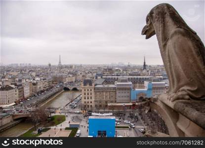 Famous chimere of Notre-Dame overlooking Paris. Notre Dame de Paris, Paris, Europe. Chimera of the Cathedral Notre Dame de Paris