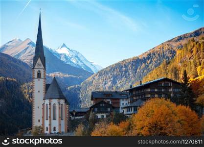 famous church at the Heiligenblut town at the austrian alpine Grossglockner road at the autumn day