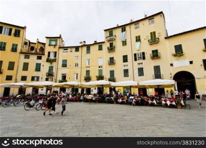 Famous circular Piazza dell&rsquo;Anfiteatro, the ancient site of a Roman Amphitheatre, in Lucca, Tuscany, Italy.