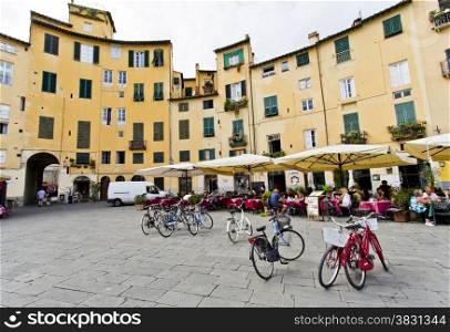 Famous circular Piazza dell&rsquo;Anfiteatro, the ancient site of a Roman Amphitheatre, in Lucca, Tuscany, Italy.