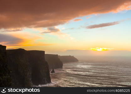 Famous cliffs of Moher at sunset in Co. Clare Ireland Europe. Beautiful landscape as natural attraction.