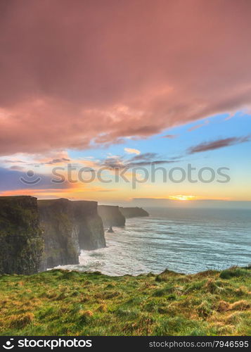 Famous cliffs of Moher at sunset in Co. Clare Ireland Europe. Beautiful landscape as natural attraction.