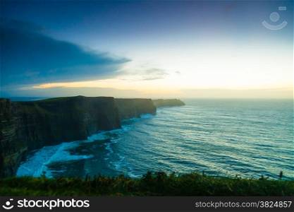 Famous cliffs of Moher at sunset in Co. Clare Ireland Europe. Beautiful landscape natural attraction.