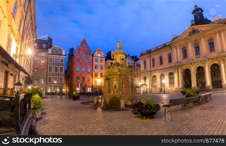 Famous colorful houses on Stortorget square and the well, Gamla Stan in Old Town of Stockholm, the capital of Sweden. Stortorget square in Stockholm, Sweden