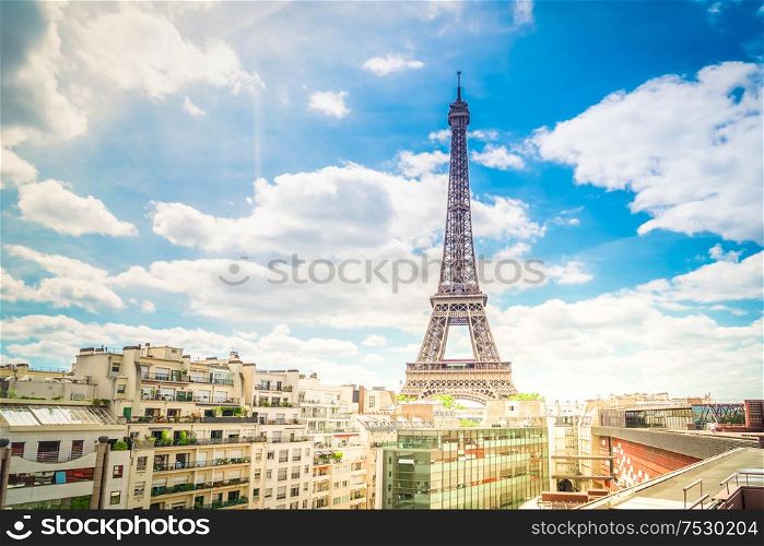 famous Eiffel Tower landmark and Paris old roofs, Paris France, toned. eiffel tour and Paris cityscape