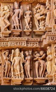 Famous erotic stone carving sculptures, Lakshmana Temple, Khajuraho, India. Unesco World Heritage Site. Famous sculptures of Khajuraho temples, India
