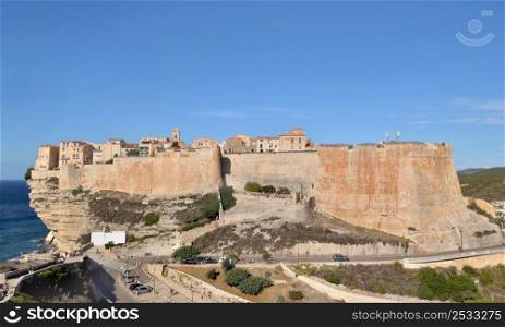 famous fortress at Bonifacio in Corsica under blue sky