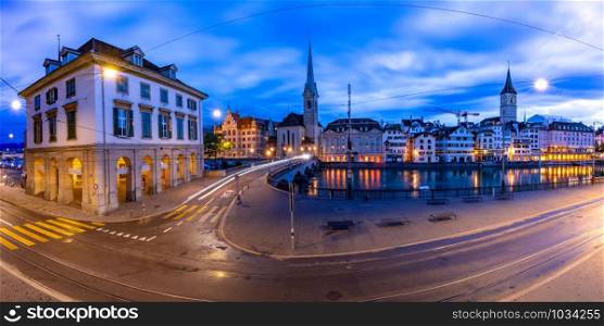 Famous Fraumunster and Church of St Peter an river Limmat Embankment during morning blue hour in Old Town of Zurich, the largest city in Switzerland. Zurich, largest city in Switzerland