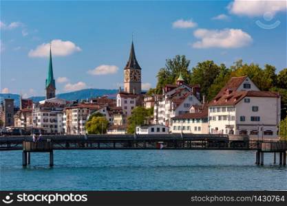 Famous Fraumunster and Church of St Peter and river Limmat Old Town of Zurich, the largest city in Switzerland. Zurich, the largest city in Switzerland