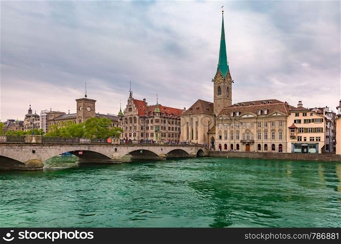 Famous Fraumunster and river Limmat on the cloudy day in Old Town of Zurich, the largest city in Switzerland. Zurich, the largest city in Switzerland
