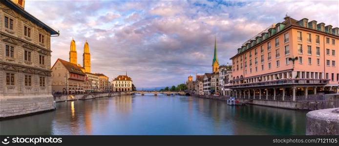 Famous Fraumunster, Grossmunster and Wasserkirche churches along river Limmat at sunrise in Old Town of Zurich, the largest city in Switzerland. Zurich, largest city in Switzerland