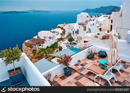 Famous greek iconic selfie spot tourist destination Oia village with traditional white houses and windmills in Santorini island, Greece. Famous greek tourist destination Oia, Greece