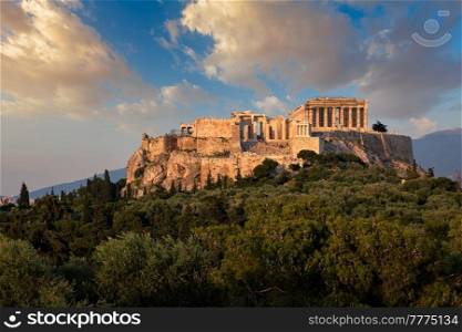 Famous greek tourist landmark - the iconic Parthenon Temple at the Acropolis of Athens as seen from Philopappos Hill on sunset. Athens, Greece. Iconic Parthenon Temple at the Acropolis of Athens, Greece