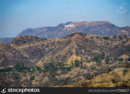 famous hollywood sign on a hill in a distance