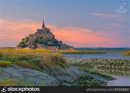 Famous Le Mont Saint-Michel tidal island in Normandy, northern France at sunset 