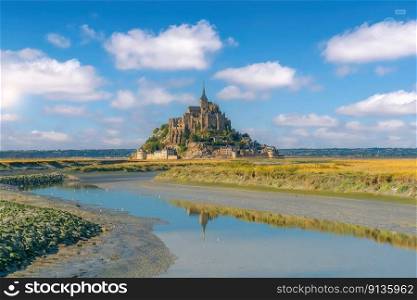 Famous Le Mont Saint-Michel tidal island in Normandy, northern France at sunset 