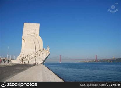 famous monument to the maritime discoveries in Lisbon, Portugal (April 25th bridge on the background)