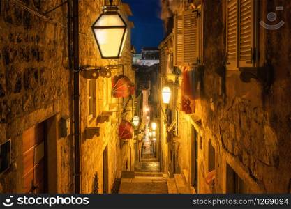 Famous narrow alley of Dubrovnik old town in Croatia at night - Prominent travel destination of Croatia. Dubrovnik old town was listed as UNESCO World Heritage Sites in 1979.