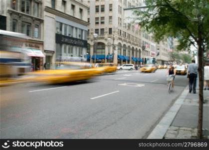 Famous New York yellow taxi cabs in motion