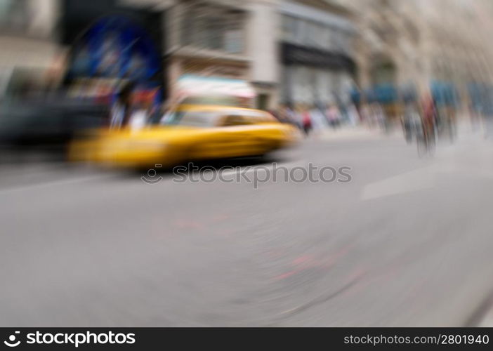 Famous New York yellow taxi cabs in motion - intentional blur