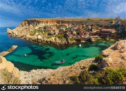 Famous Popeye Village at Anchor Bay, Malta. Aeril panorama of Popeye Village in the sunny day, Malta