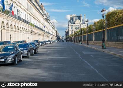 Famous Rivoli street in Paris with cars and park. Paris, France
