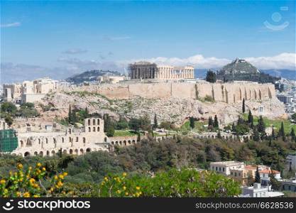 Famous skyline of Athens with Acropolis hill, Pathenon, Herodes Atticus&hitheater and Lycabettus Hill, Athens Greece. Famous skyline of Athens, Greece