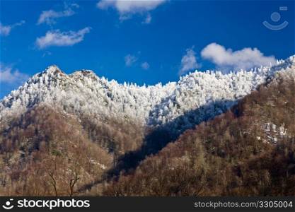 Famous Smoky Mountain view of Chimney Tops covered in snow in early spring