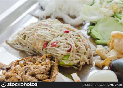 Famous Thai style food, spicy papaya salad
