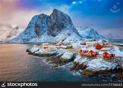 Famous tourist attraction Hamnoy fishing village on Lofoten Islands, Norway with red rorbu houses in winter. Hamnoy fishing village on Lofoten Islands, Norway