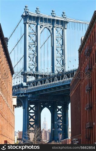 Famous view at Manhattan Bridge and Empire State Building from Brooklyn in New York City
