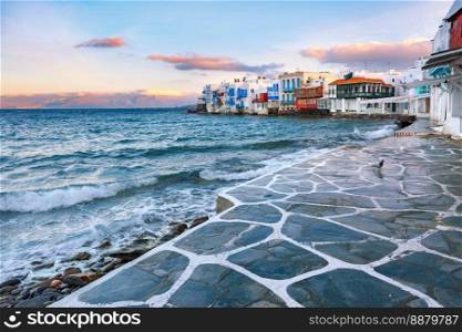 Famous view, Mikri Venetia or Little Venice during morning blue hour on the island Mykonos, The island of the winds, Greece. Little Venice at sunset on island Mykonos, Greece