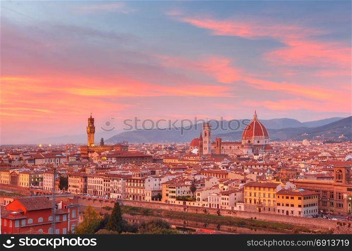 Famous view of Florence at gorgeous sunset, Italy. Duomo Santa Maria Del Fiore and tower of Palazzo Vecchio at gorgeous sunset from Piazzale Michelangelo in Florence, Tuscany, Italy