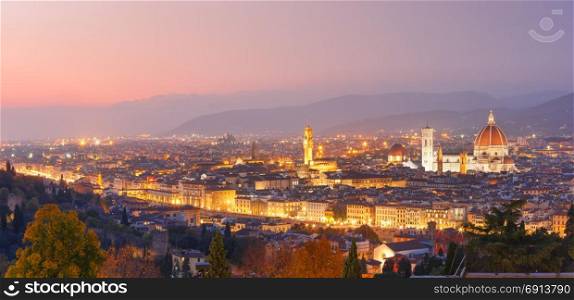 Famous view of Florence at gorgeous sunset, Italy. Beautiful panoramic view of Duomo Santa Maria Del Fiore and tower of Palazzo Vecchio at beautiful sunset in Florence, Tuscany, Italy