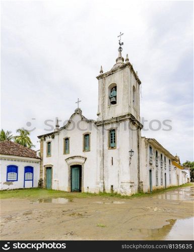 Famous white church facade in the ancient and historic city of Paraty on the south coast of the state of Rio de Janeiro founded in the 17th century. Famous white church facade in the ancient and historic city of Paraty