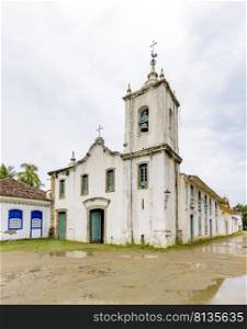 Famous white church facade in the ancient and historic city of Paraty on the south coast of the state of Rio de Janeiro founded in the 17th century. Famous white church facade in the ancient and historic city of Paraty