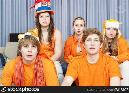 Fans, watching their national team at home looking tens and somewhat nervous at the events happening