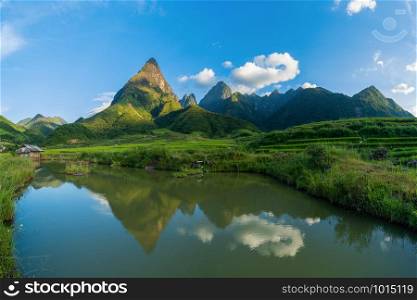 Fansipan mountain hills valley on summer with lake at sunset in travel trip and holidays vacation concept, Sapa, Vietnam. Nature landscape background.